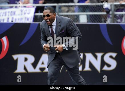 Former Baltimore Ravens linebacker Ray Lewis Jr., second from left, his  sons Rayshad, 14, left, Rahsaan, 12, second from right, and the mother Lewis'  three sons, Tatyana McCall, arrive for a national