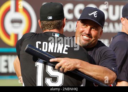 Former Miami Marlins player Jeff Conine waves to fans as he arrives for a  Miami Marlins baseball FanFest event, Saturday, Feb. 11, 2023, in Miami.  Conine is now a special assistant to