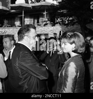 Italian actress Claudia Cardinale and Italian movie director Federico Fellini are shown during the symbolic ceremony of the Oscar Academy Award given to Federico Fellini for his film “Eight And A Half” in a Rome, Italy, theater on May 26, 1964. Italian Premier Aldo Moro handed the statuette to Fellini during the ceremony, arranged so that Italian cinema personalities and Government officials could demonstrate their appreciation of Fellini’s achievement in winning the Award. Fellini was present in Santa Monica, California on April 14, to receive his statuette for the best foreign film. (AP Phot