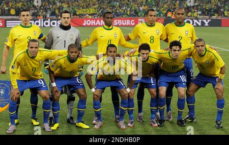 Brazil players, front row from left, Ramires, Daniel Alves, Kaka, Robinho,  Michel Bastos, back row from left, Lucio, Julio Cesar, Luis Fabiano, Juan,  Maicon, and Gilberto Silva pose for a team photo