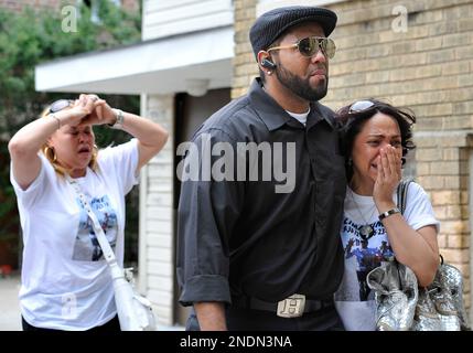 Dora Astacio, center, wife of Jose Lima, is comforted outside of the wake  for her husband Jose Lima at Coppola-Migliore Funeral Home in New York, on  Friday, May 28, 2010. Lima, a