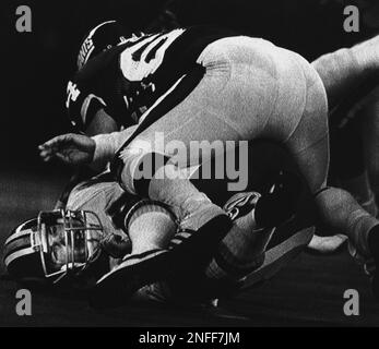 Washington Redskins wide receiver Art Monk (81) is stopped in his tracks by  New York Giants iinebacker Harry Carson (53) as he receives a Jay Schroeder  pass in the third quarter action