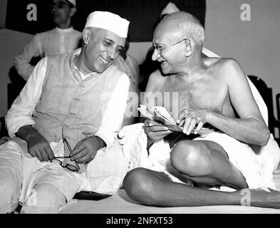 Bespectacled Mahatma Gandhi, who eventually led India to its independence, laughs with the man who was to be the nation's first prime minister, Jawaharlal Nehru, at the All-India Congress committee meeting in Bombay, India, on July 6, 1946. Nehru took office as president of the Congress during the session. Gandhi's philosophy of non-violent resistance, including civil disobedience and fasts, drove India to independence in 1947 after nearly 200 years of British rule. The father of modern India, the Mahatma, which means great soul, was assassinated in 1948 for his tolerance of other religions. (