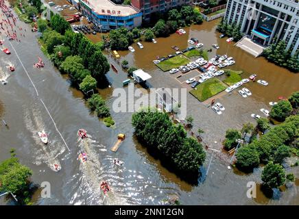 Rescuers Transfer Citizens Out Of The Flooded Zone In A Massive ...