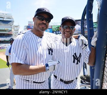 Former New York Yankees outfielders Bernie Williams (51), and Paul O'Neill,  right, greet each other at the Yankees 67th annual Old Timers Day baseball  game Sunday, June 23, 2013, in New York. (