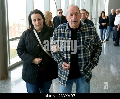 In this Thursday, May 4, 2017 photo, Roseann Rodriguez and Angelo Rodriguiez, the sister and father of the deceased Joseph Rodriguez, walk inside the Richmond Supreme Courthouse, in Staten Island, N.Y. Former New Jersey police officer Pedro Abad was convicted Thursday in a wrong-way crash that killed a fellow officer and Rodriguez in what prosecutors said was the result of extreme intoxication. (Ed Murray/NJ Advance Media via AP)