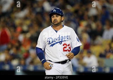 Los Angeles Dodgers first base coach Davey Lopes looks at a stopwatch  during the second inning of a baseball game against the Milwaukee Brewers  Tuesday, May 21, 2013, in Milwaukee. (AP Photo/Morry