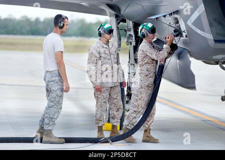 U.S. Marine Corps Sgt. Robert Coates monitors the 'hot' refueling of an F-35B Lightning II joint strike fighter at Eglin Air Force Base in Fort Walton Beach, Fla., on Wednesday, May 22, 2013. In the year since the Marine Fighter Attack Training Squadron-501 flew its first F-35B mission at Eglin's 33d Fighter Wing, it's pilots have flown 833 local sorties and logged about 1,100 flight hours as well as developed procedures like this one for refueling the F-35B with the engine 'hot' or running. Eglin in the heart of F-35 training worldwide for the Air Force, Marines, Navy and international partne