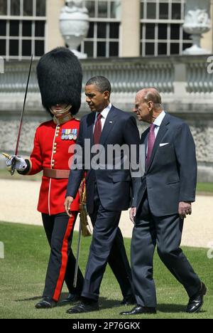 US President Barack Obama, center, prepares to inspect the guard of honor 1st battalion Scots Guards with Britain's Prince Philip, right, at Buckingham Palace in London, on Tuesday May 24, 2011. President Barack Obama and first lady Michelle Obama traded-in Irish charm for the pomp and pageantry of Buckingham Palace Tuesday as they opened a two-day state visit to Britain at the invitation of Queen Elizabeth II. (AP Photo/Adrian Dennis, Pool)