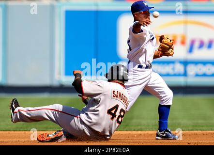 Los Angeles Dodgers shortstop Rafael Furcal, left, and center fielder  Andruw Jones collide as they chas a ball hit for a single by Atlanta  Braves' Brian McCann in the fifth inning of