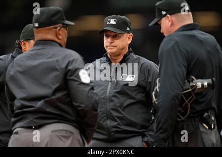 Umpire Erich Bacchus stands on the field between innings of the first  baseball game of a doubleheader between the Pittsburgh Pirates and the  Washington Nationals, Saturday, April 29, 2023, in Washington. (AP