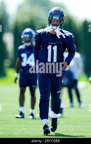 Seattle Seahawks wide receiver Jaxon Smith-Njigba (11) stands with  teammates including tight end Will Dissly (89) and tight end Colby  Parkinson (84) May 22, 2023, at the team's NFL football training facility