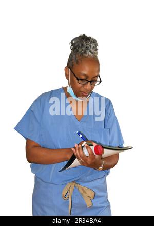 Una enfermera vestida con sus peelings del hospital. Foto de stock