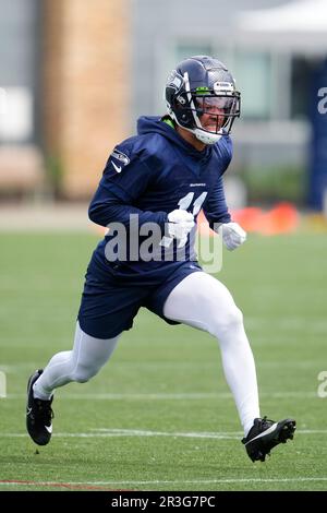 Seattle Seahawks wide receiver Jaxon Smith-Njigba (11) stands with  teammates including tight end Will Dissly (89) and tight end Colby  Parkinson (84) May 22, 2023, at the team's NFL football training facility