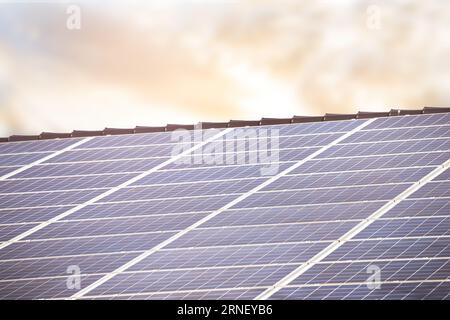 solar panels attached to roof to produce power and energy by sunlight environmental friendly Stock Photo