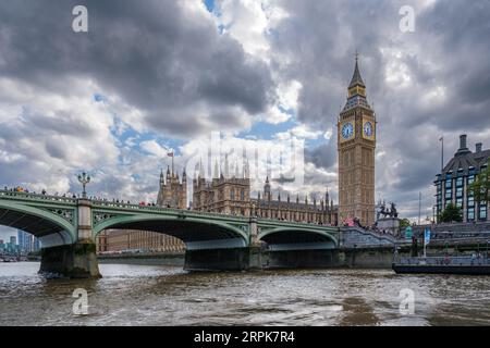 Westminster, London, England - 29th July 2023: Black and white image of Big Ben and the houses of Parliament and Westminster Bridge on the River Thame Stock Photo