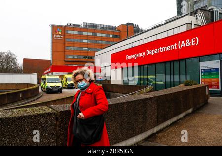 210109 -- LONDON, Jan. 9, 2021 -- A woman wearing a face mask walks out of the Emergency Department of St Thomas Hospital in London, Britain, Jan. 8, 2021. Britain recorded another 68,053 coronavirus cases, the highest ever daily increase since the pandemic began in the country, official figures showed Friday. The total number of coronavirus cases in the country stands at 2,957,472, the data showed. Also on Friday, Mayor of London Sadiq Khan declared a major incident in the British capital as rising coronavirus cases are threatening to overwhelm hospitals.  BRITAIN-LONDON-COVID-19 CASES-HIGHES Stock Photo