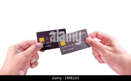 Tarjetas de crédito o débito y concepto de privilegios financieros, mano sosteniendo tarjetas de crédito y débito aisladas sobre fondo blanco. Foto de stock