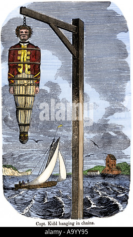Capitán pirata William Kidd en cadenas colgadas a muerte en Inglaterra 1701. Xilografía coloreada a mano Foto de stock