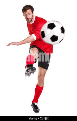 Foto de un futbolista o jugador de fútbol recortadas sobre un fondo blanco.