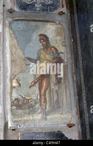 Fotografía de una pintura de un soldado romano en un muro en las ruinas de la antigua ciudad romana de Pompeya