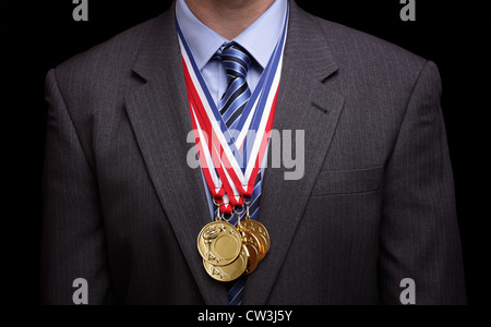 Empresario exitoso con medallas de oro Foto de stock
