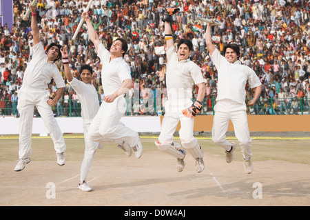 Los jugadores de cricket celebra su éxito