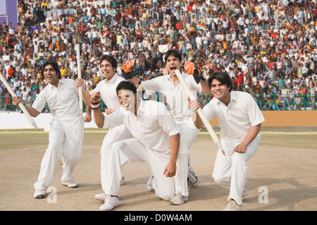 Los jugadores de cricket celebra su éxito