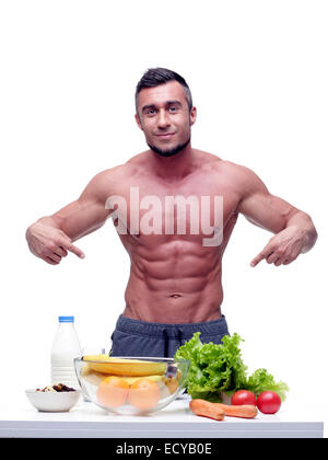 Hombre Muscular Hermoso En Un Delantal De Cocina En La Cocina De
