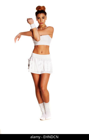Bastante joven jugador de tenis femenino estiramiento Foto de stock
