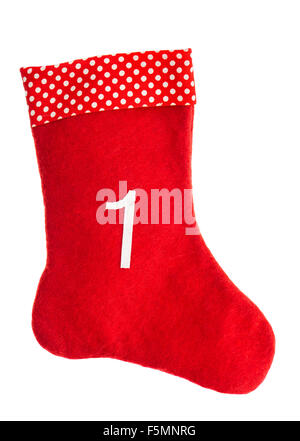 Calcetines para regalos de Navidad roja sobre un fondo blanco. Stocking. Símbolo de adviento Foto de stock