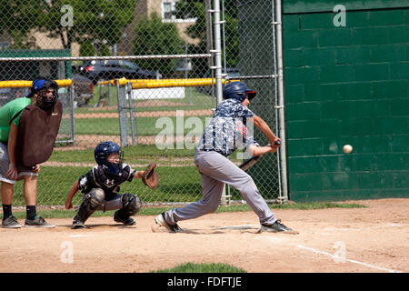 Umpire Andrea Galiano handles the home plate umpiring chores