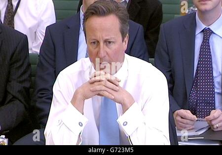 El primer Ministro David Cameron aparece ante el Comité de enlace en la Cámara de los comunes, Londres, ya que da pruebas de la respuesta del Gobierno a la crisis de Ucrania y las acciones del presidente ruso Vladimir Putin. Foto de stock
