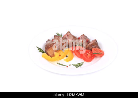 Bisteces con tomates y romero. Foto de stock