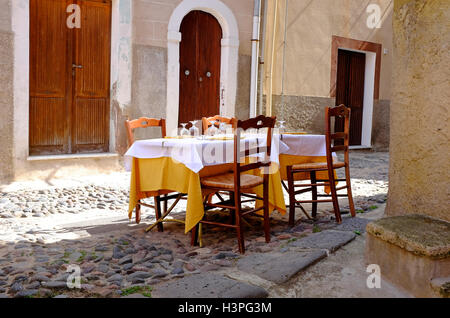 street scene outside restaurant, bosa, cerdeña, italia