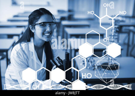 Imagen Gráfica de Estructura química contra el retrato de colegiala feliz celebración microscopio en laboratorio