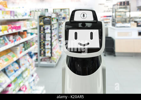 Retail , inteligente robot ayudante , robo advisor , la inteligencia artificial , un servicio de navegación en el departamento de tecnología del robot retail store. La Sonrisa del robot Foto de stock