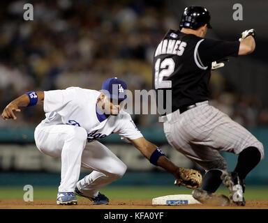 Los Angeles Dodgers shortstop Rafael Furcal, left, and center fielder  Andruw Jones collide as they chas a ball hit for a single by Atlanta  Braves' Brian McCann in the fifth inning of