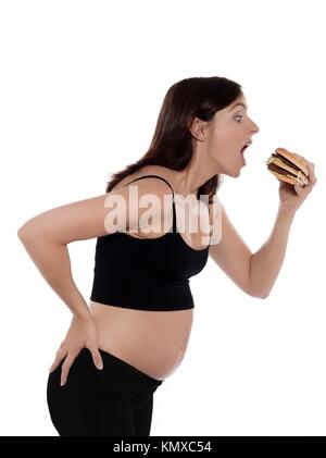 Embarazada mujer caucásica glotón starvingisolated studio sobre fondo blanco.