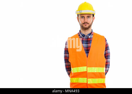 Joven apuesto hombre barbado, trabajador de la construcción