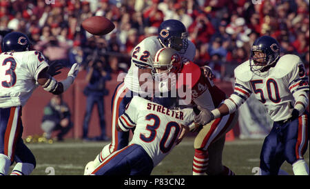 Chicago Bears linebacker Mike Singletary looms in on Minnesota Vikings  quarterback Steve Dils as he fumbles in the fourth quarter of game causing  an 11-yard loss, Dec. 11, 1983 in Minneapolis. Dils