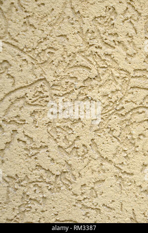 La textura del yeso decorativo beige en corteza escarabajo estilo. Federación de variación de decorar paredes de fachada