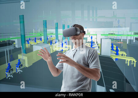 Imagen compuesta de ingeniero con casco de realidad virtual en suite VR