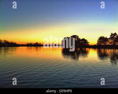 Hatchet estanque sunset Foto de stock