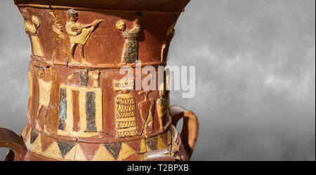 Cerca del socorro hitita Inandik decorado libación culto jarrón decorado con una mujer y hombre figuras en relieve de color crema, rojo y negro pla