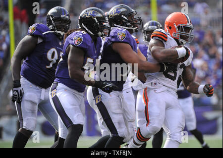 Cleveland Browns Trent Richardson is stopped by Philadelphia Eagles' DeMeco  Ryans, behind, and Kurt Coleman at Cleveland Browns Stadium Sunday,  September 9, 2012 in Cleveland, Ohio. The Eagles defeated the Browns,  17-16. (