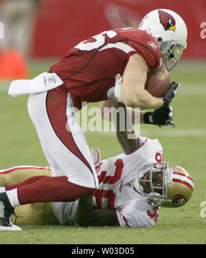 Arizona Cardinals wide receiver Jerheme Urban (85) fumbles the ball as New  Orleans Saints cornerback Randall Gay (20) and safety Roman Harper (41)  defend an NFL football divisional playoff game in New