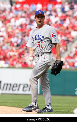 Chicago Cubs pitcher Greg Maddux (R) takes the baseball from catcher Paul  Bako after Maddux hit St. Louis Cardinals Ray Lankford iwith a pitch n the  third inning at Busch Stadium in