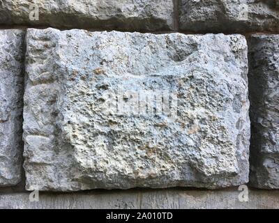 Gros gris brique de mur de pierre modèle sur d'anciens bâtiment historique Banque D'Images