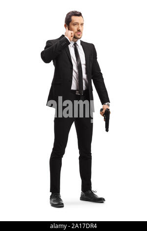 Portrait d'un garde du corps avec une arme à feu isolé sur fond blanc Banque D'Images